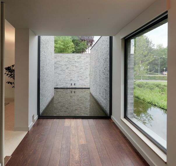 ConceptSystem 68 Janelas e ConceptSystem 68 Portas - Villa Villa Rotonda: Uma combinação de magia, com um toque moderno e contemporâneo localizado em Goirle, nos Países Baixos