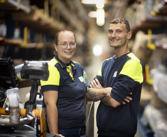 Two Reynaers warehouse employees.