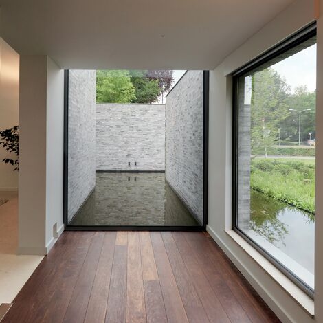 ConceptSystem 68 Janelas e ConceptSystem 68 Portas - Villa Villa Rotonda: Uma combinação de magia, com um toque moderno e contemporâneo localizado em Goirle, nos Países Baixos